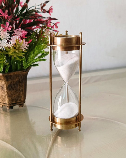 Timeless Navigation: Brass Hourglass with Compass.